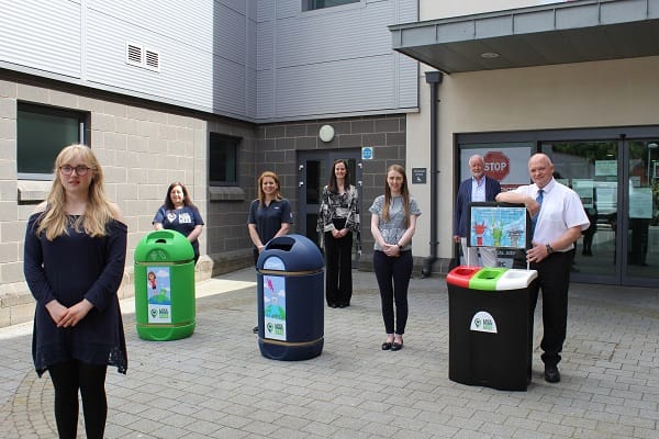 New bins displayed with designer, partners, funders and Eco team